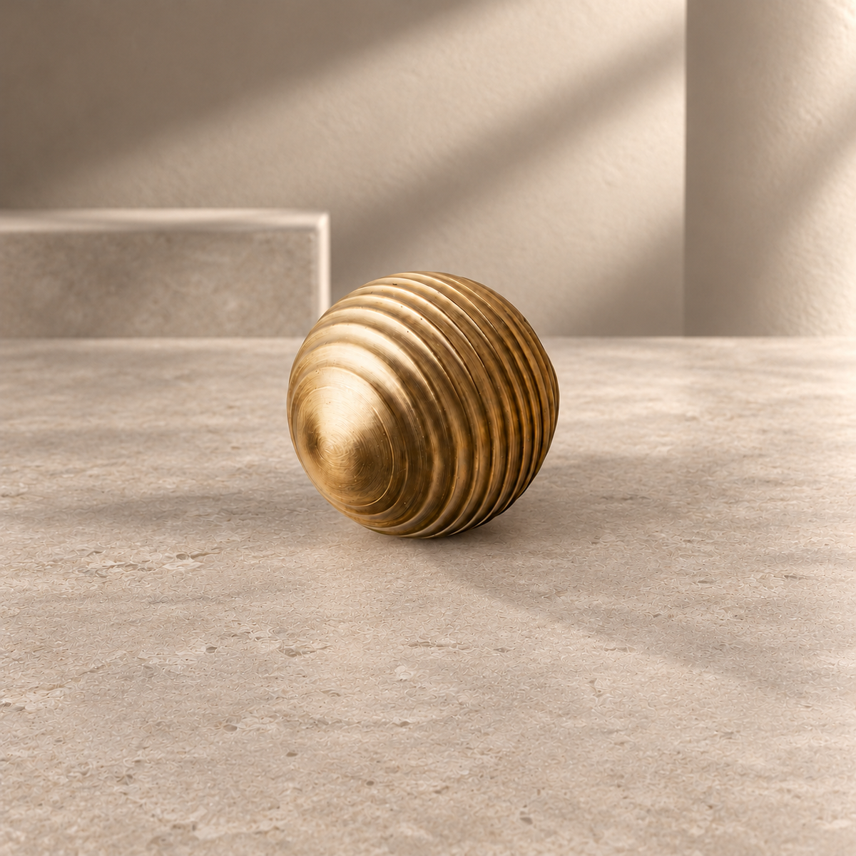 Brass Cabinet Knob — Thread Ball Design, Gold Finish on a neutral stone studio background