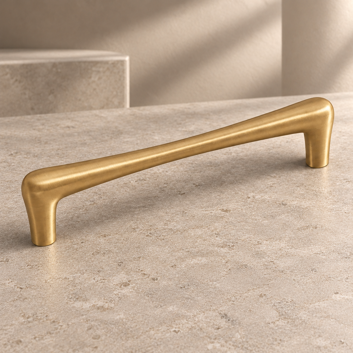 Brushed Brass Teardrop Solid Brass Cabinet Pulls & Knobs on a neutral stone studio background