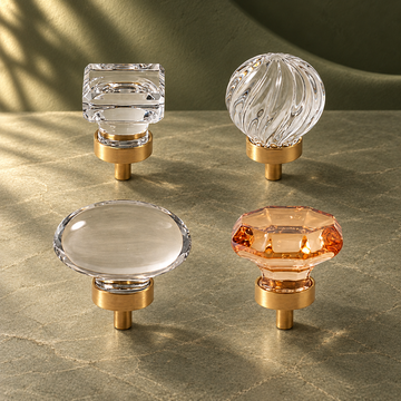 Crystal Brass Cabinet Knob — Clear Pigeon Egg Design on a deep olive studio background