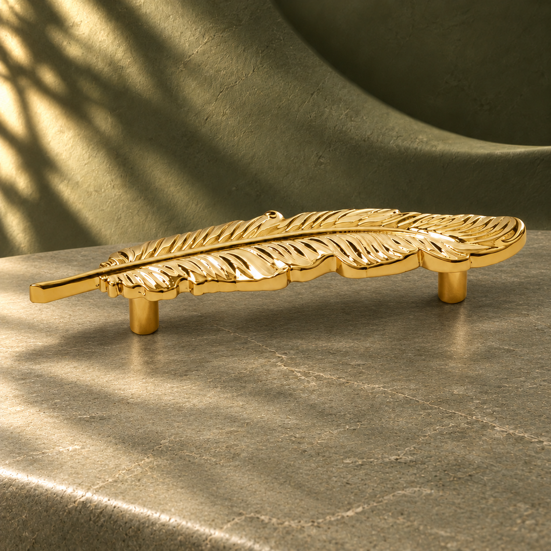 Feather Statement Cabinet Handle — Sculpted Brass Pull on a deep olive studio background
