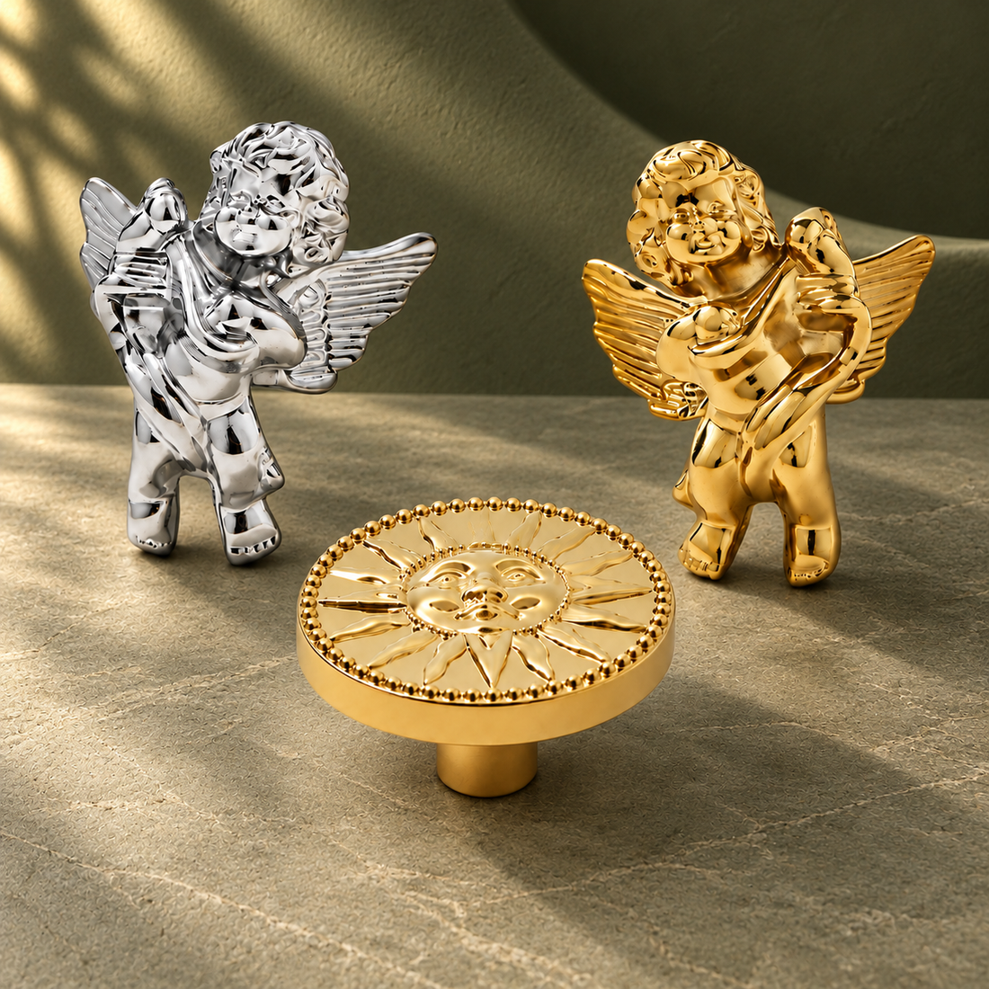 Gold & Silver Sun Angel Cabinet Knob — Solid Brass Decorative Hardware on a deep olive studio background