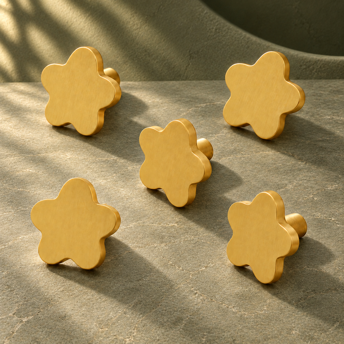Gold Star Cabinet Knob — Solid Brass Decorative Hardware on a deep olive studio background