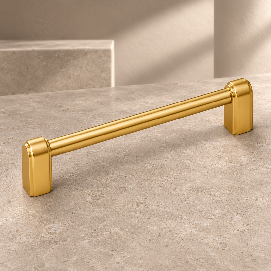 Polished Brass Cabinet Pulls & T-Knob — Modern Luxury Design on a neutral stone studio background