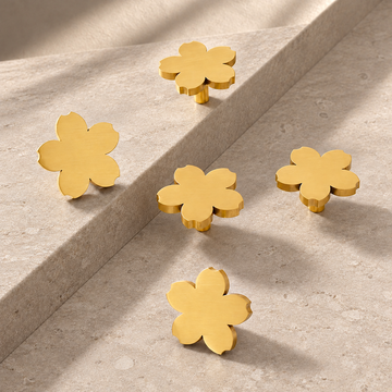 Polished Brass Solid Brass Cabinet Knob — Floral Design on a neutral stone studio background