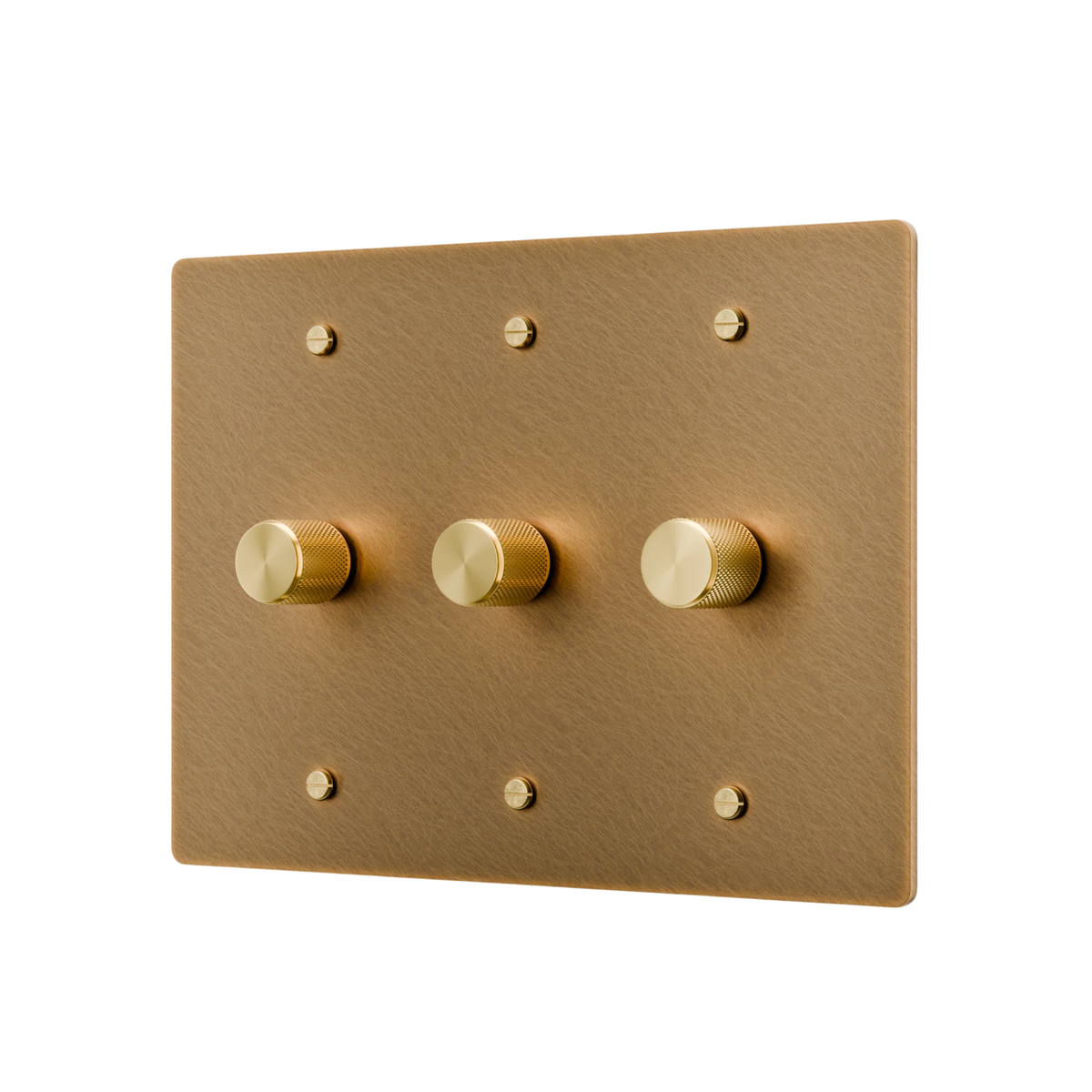 Gold switch panel with three gold knobs on a white background