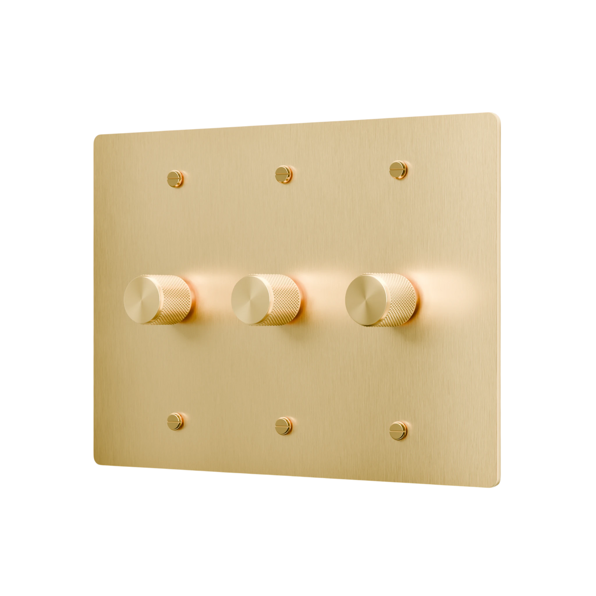 Gold light switch panel with three knobs on a white background