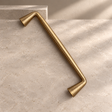 Solid Antique Brass Cabinet Handle & Knob — Antique Brass Finish on a neutral stone studio background