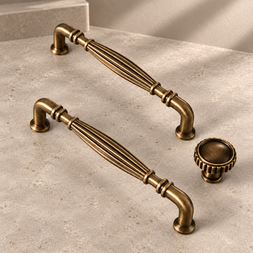Solid Antique Brass Cabinet Pull & Knob — 5" Bar Design on a neutral stone studio background