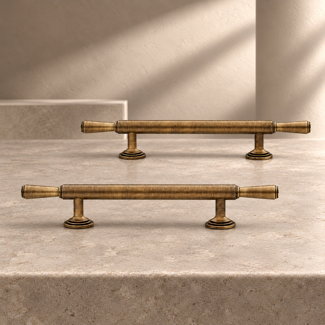 T-Bar Cabinet Pull & Knob — Antique Brass on a neutral stone studio background