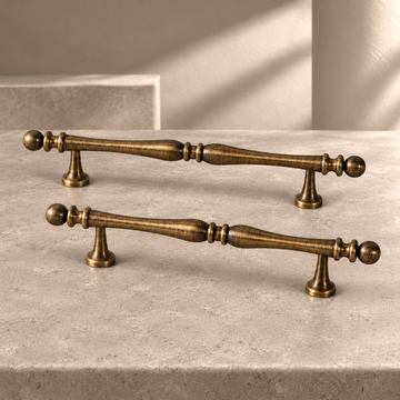 Solid Brass Cabinet Handle & Knob — Brushed Antique Brass Finish on a neutral stone studio background