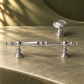 Crystal-End Cabinet Pull & Knob — Bright Chrome on a deep olive studio background
