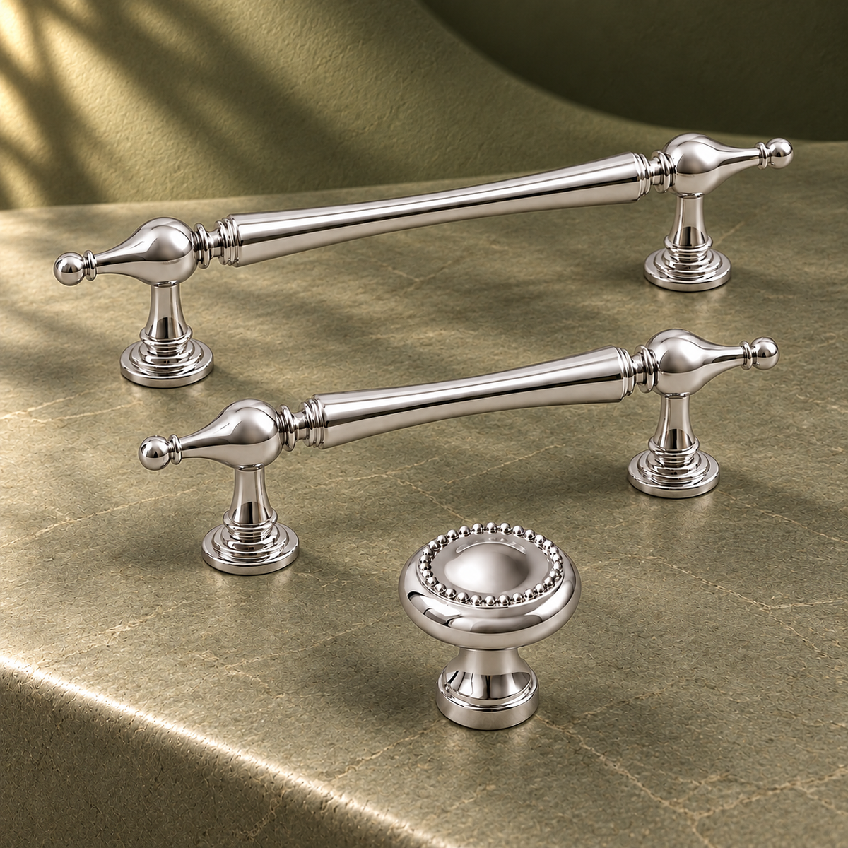 Faceted-End Cabinet Pull & Knob — Bright Chrome on a deep olive studio background