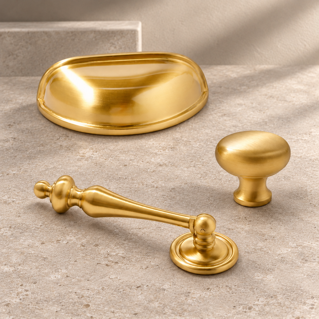 Solid Brass Cabinet Pull & Knob — Nordic Shell Design on a neutral stone studio background