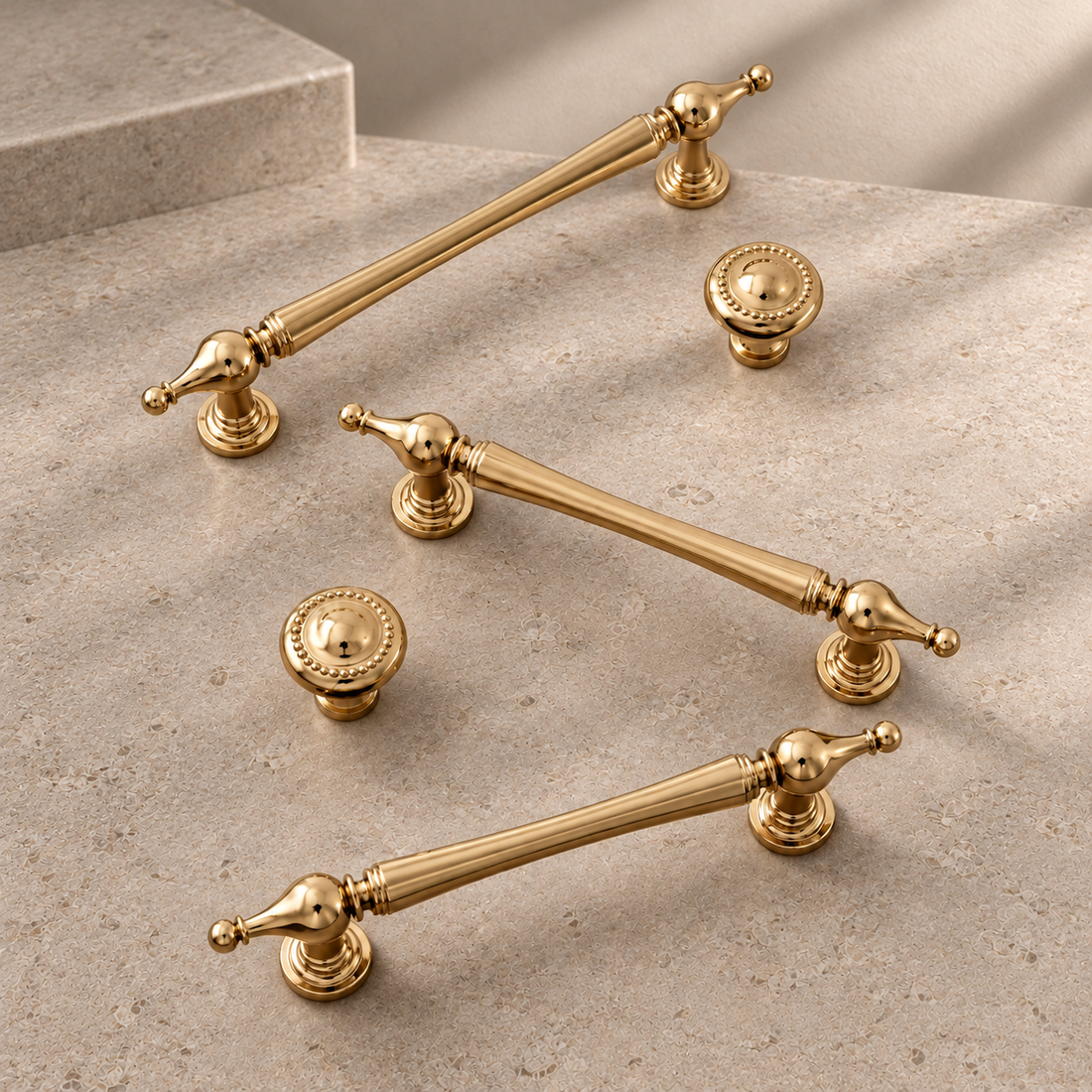 Solid Brass Cabinet Pull & Knob — PVD Bright Gold Finish on a neutral stone studio background