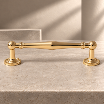 Beaded Spindle Cabinet Pull & Knob — PVD Gold on a neutral stone studio background