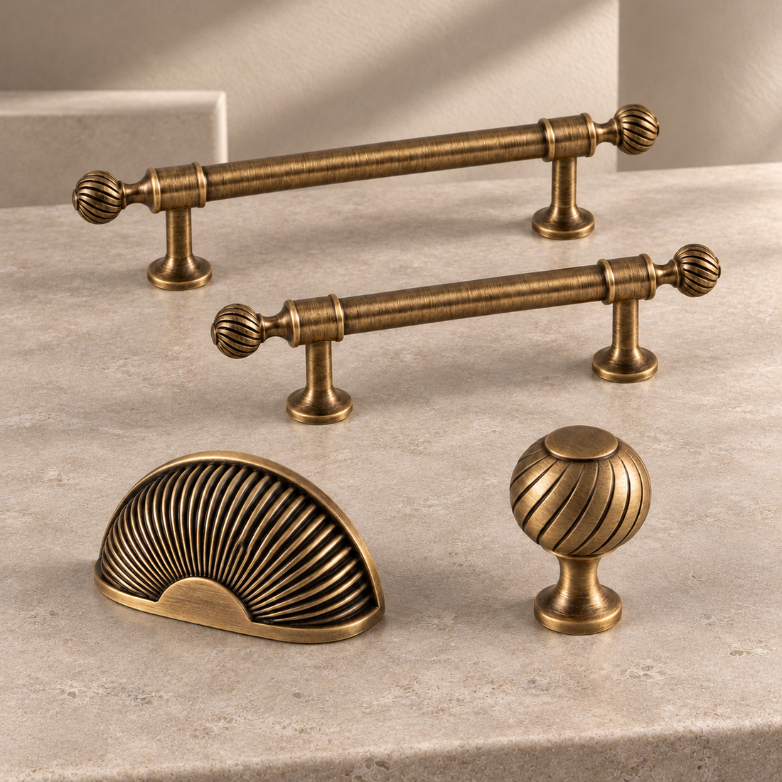 Solid Brass Shell Cabinet Pull & Knob — Antique Brass Finish on a neutral stone studio background