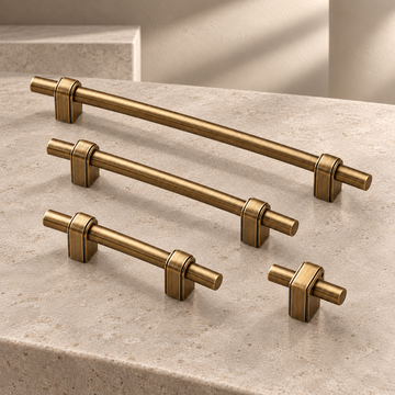 Solid Brass T-Bar Cabinet Pull & Knob — Antique Brass Finish on a neutral stone studio background
