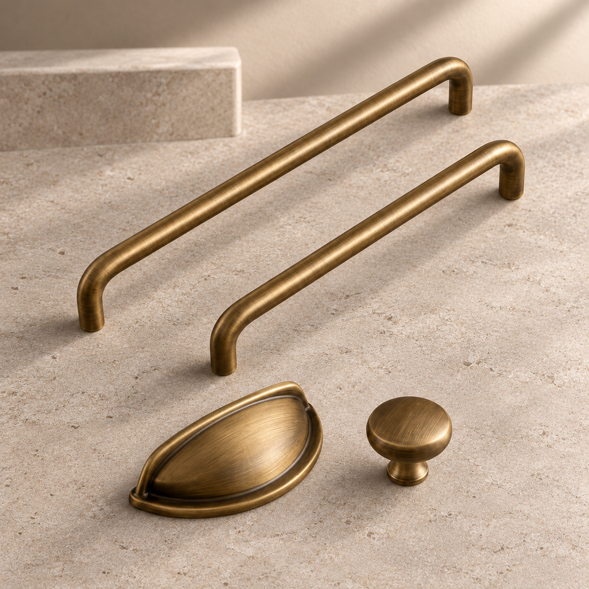 Solid Brushed Antique Brass Cabinet Pull & Knob — U-Shaped Modern Design on a neutral stone studio background