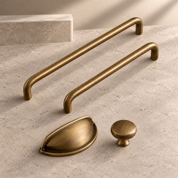 Solid Brushed Antique Brass Cabinet Pull & Knob — U-Shaped Modern Design on a neutral stone studio background
