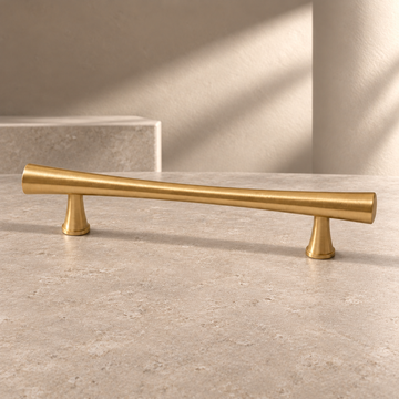 Solid Brushed Brass Cabinet Pull & Knob — High-End Modern Design on a neutral stone studio background