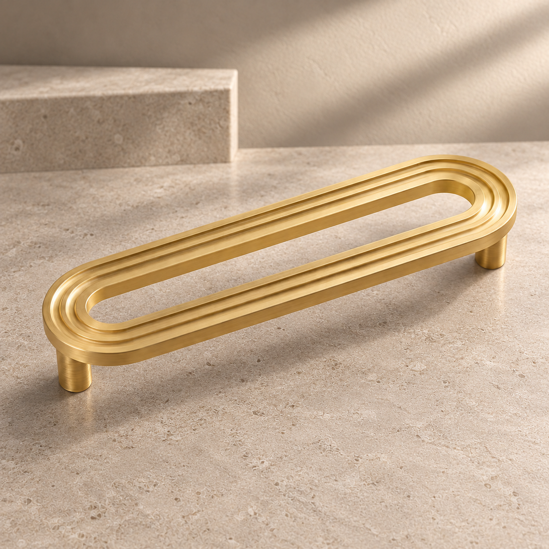 Solid Brushed Brass Cabinet Pull & Knob — Runway Design on a neutral stone studio background