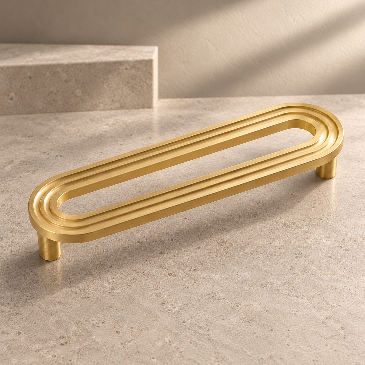 Solid Brushed Brass Cabinet Pull & Knob — Runway Design on a neutral stone studio background