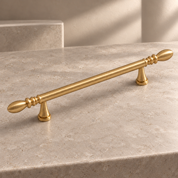 Solid Brushed Brass Cabinet Pull & Knob — Teardrop Design on a neutral stone studio background