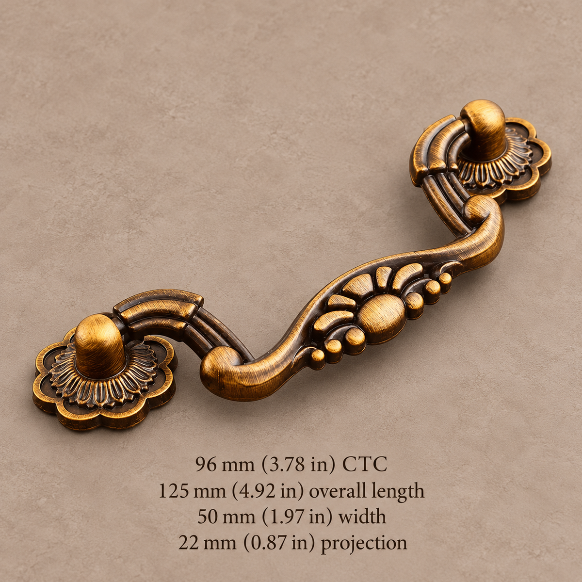 Antique brass floral 96 mm CTC cabinet pull with measurements in millimeters and inches