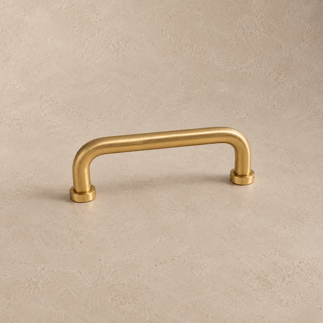 Solid Brass U-Shaped Cabinet Pull & Knob - Brushed Brass Finish on a neutral stone studio background