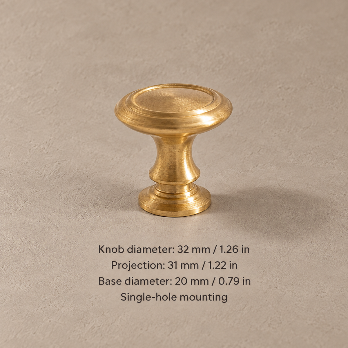 Brushed brass cabinet knob with 32 mm (1.26 in) diameter and dimensions