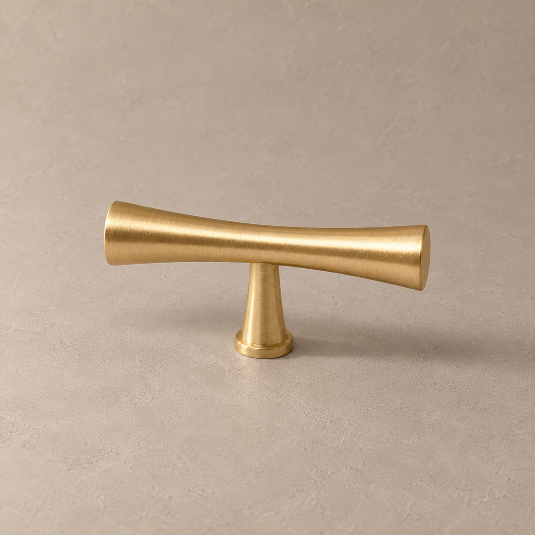 Solid Brushed Brass Cabinet Pull & Knob — High-End Modern Design on a neutral stone studio background