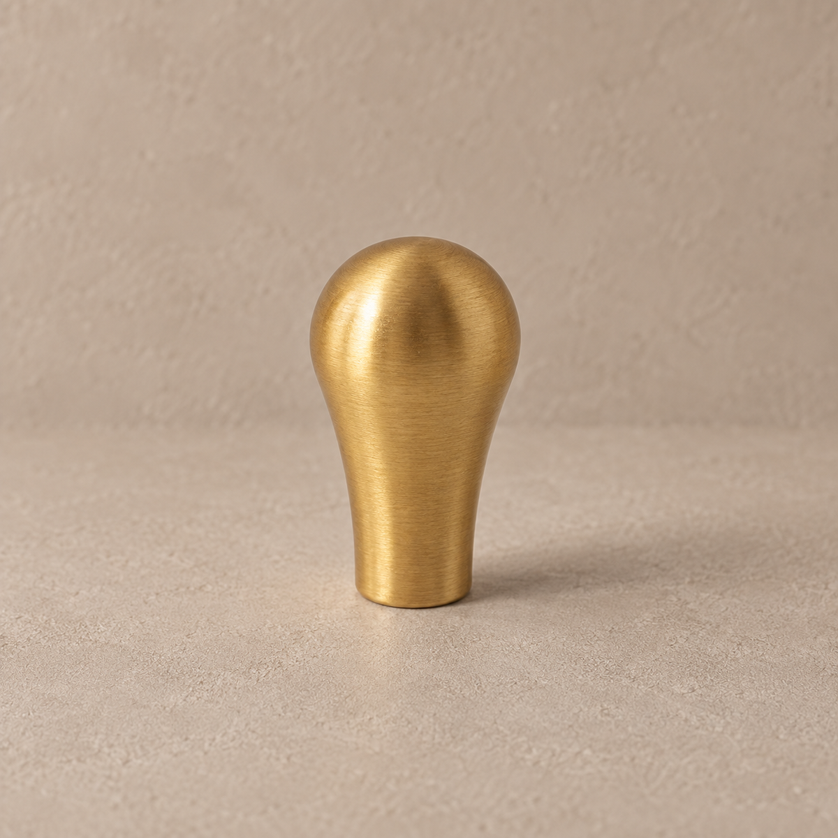 Brushed brass teardrop cabinet knob detail