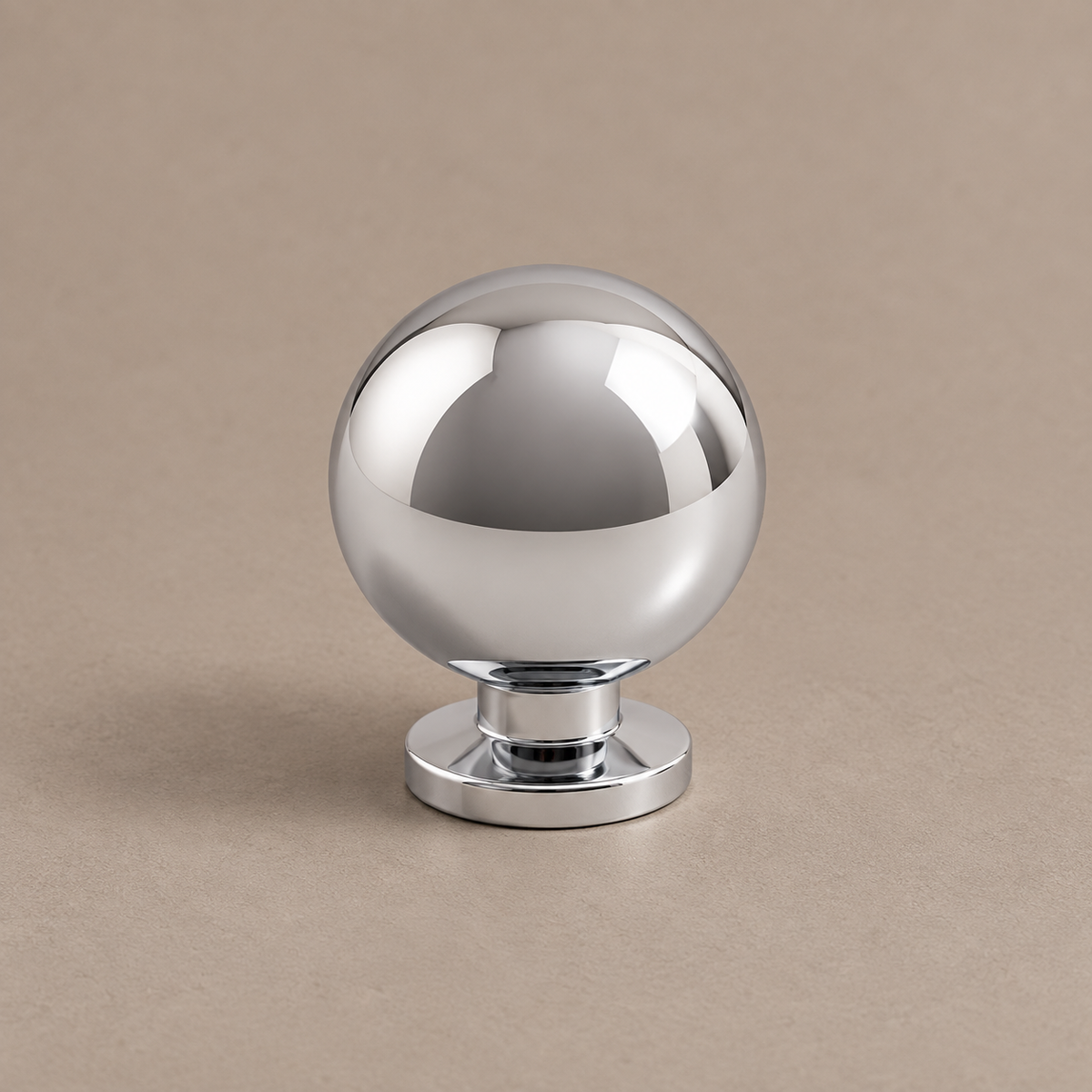 Bright chrome ball-end cabinet hardware — round-base ball knob close-up