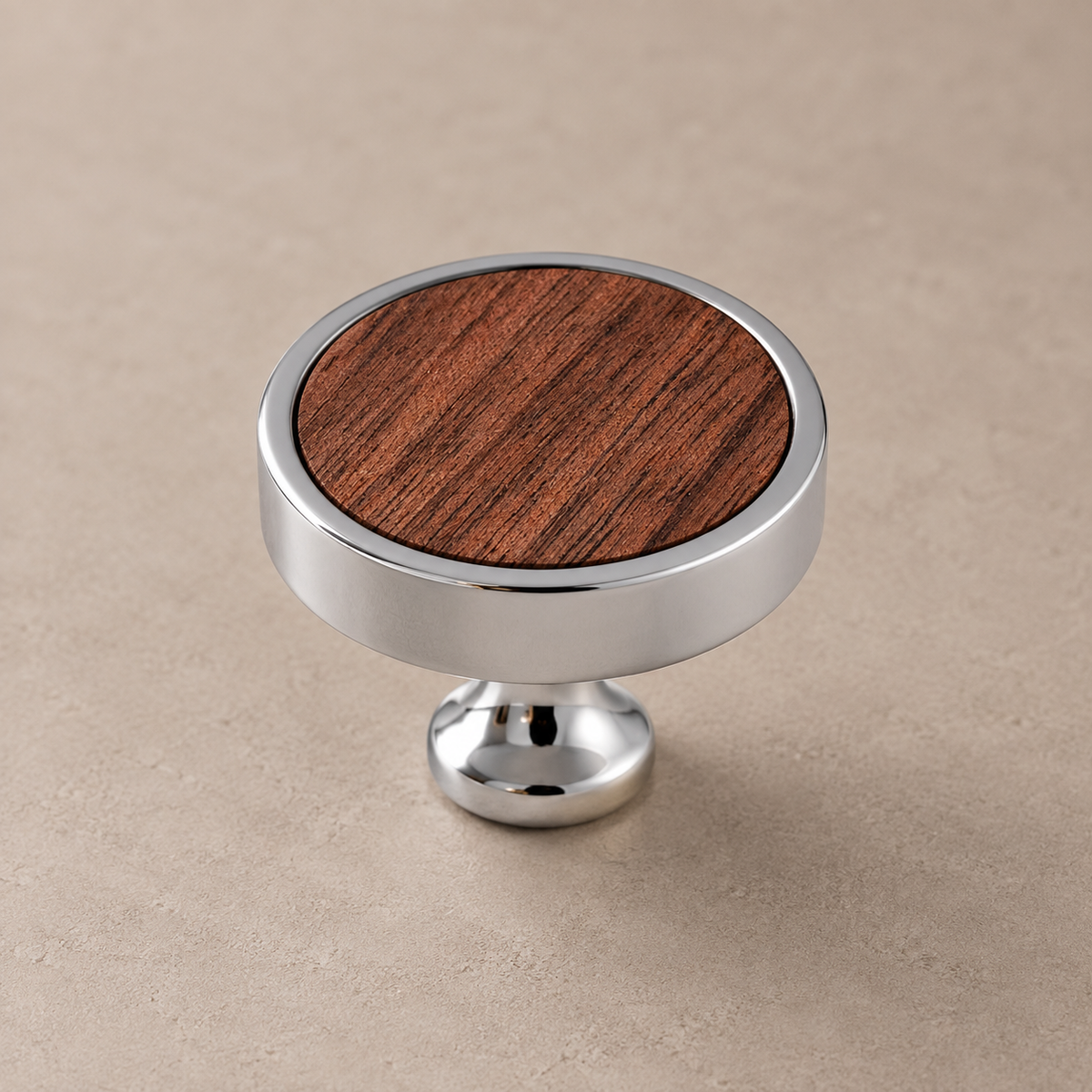 Chrome brass cabinet knob with walnut inlay on taupe studio background