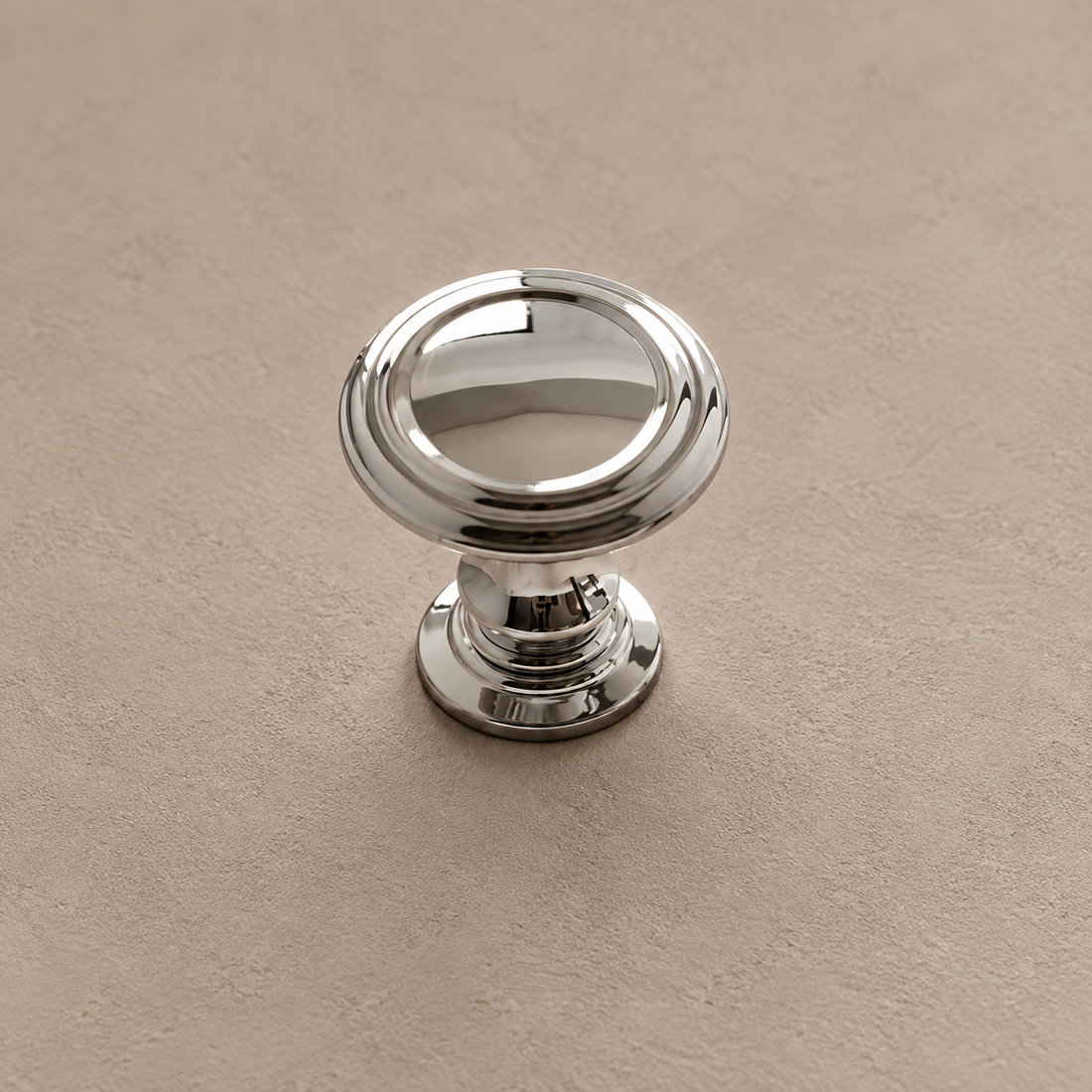 Solid Brass Cabinet Handle & Knob — Chrome Silver Finish on a neutral stone studio background
