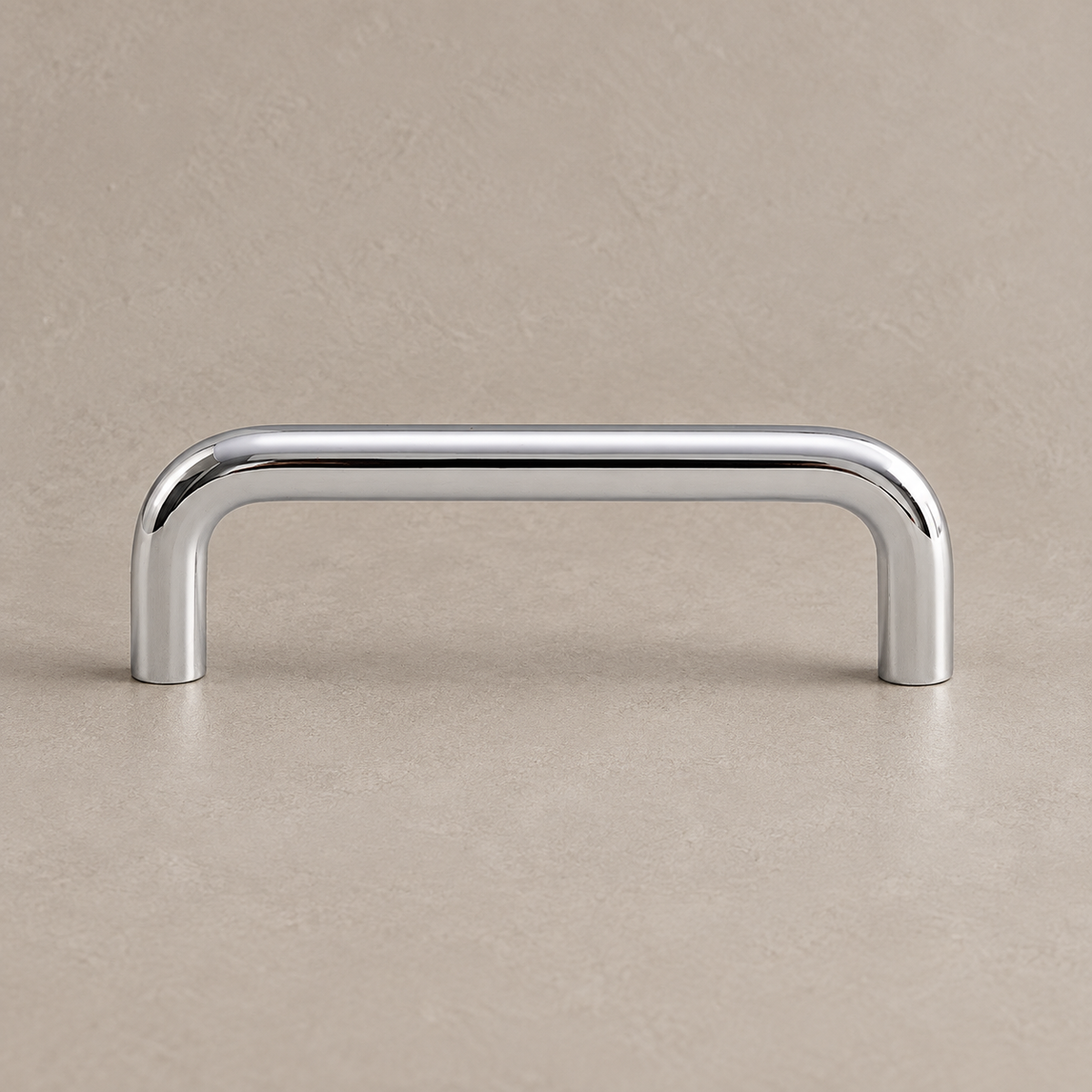 Polished chrome U-shaped cabinet pull — studio product view