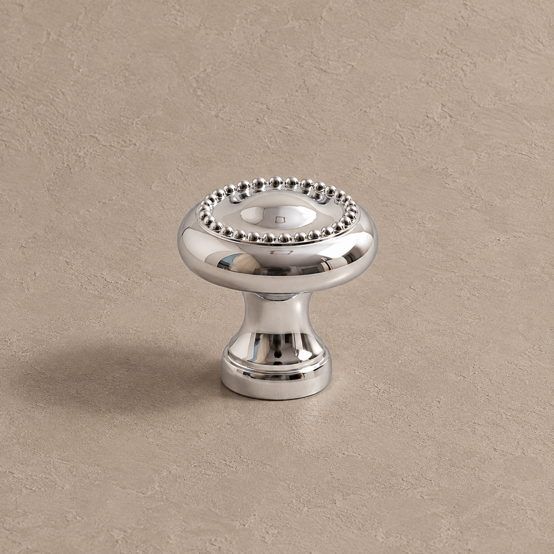 Turned Spindle Cabinet Pull & Knob — Chrome Brass on a deep olive studio background