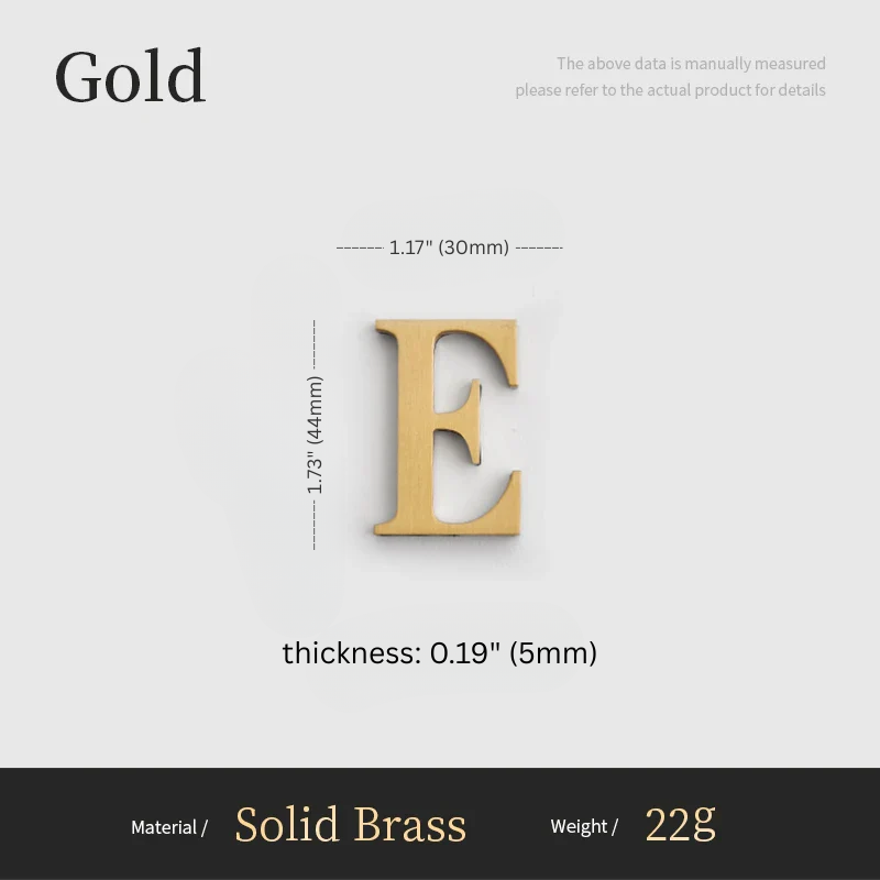 Gold letter 'E' with measurements on a gray background
