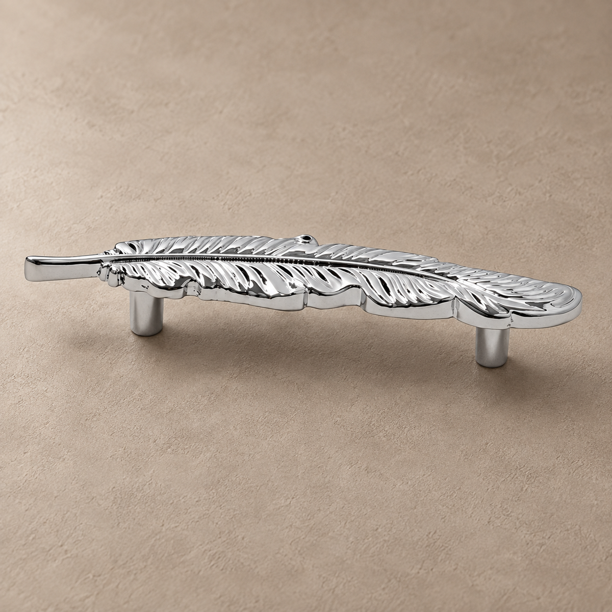 Silver chrome feather cabinet pull detail