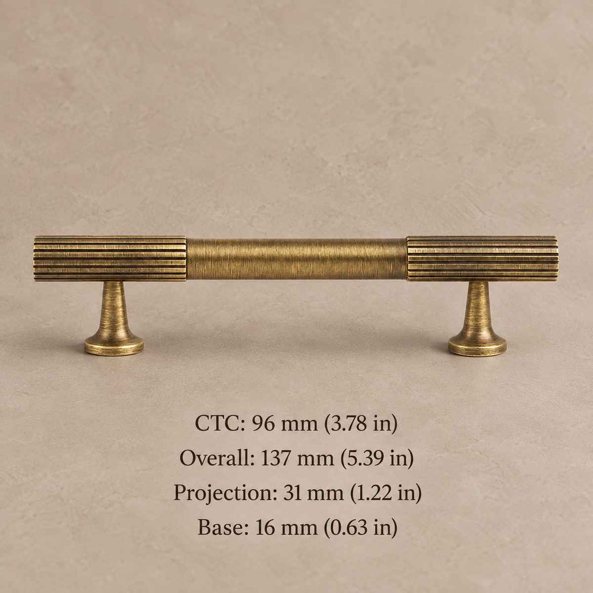 antique brass fluted cabinet pull on warm taupe studio background