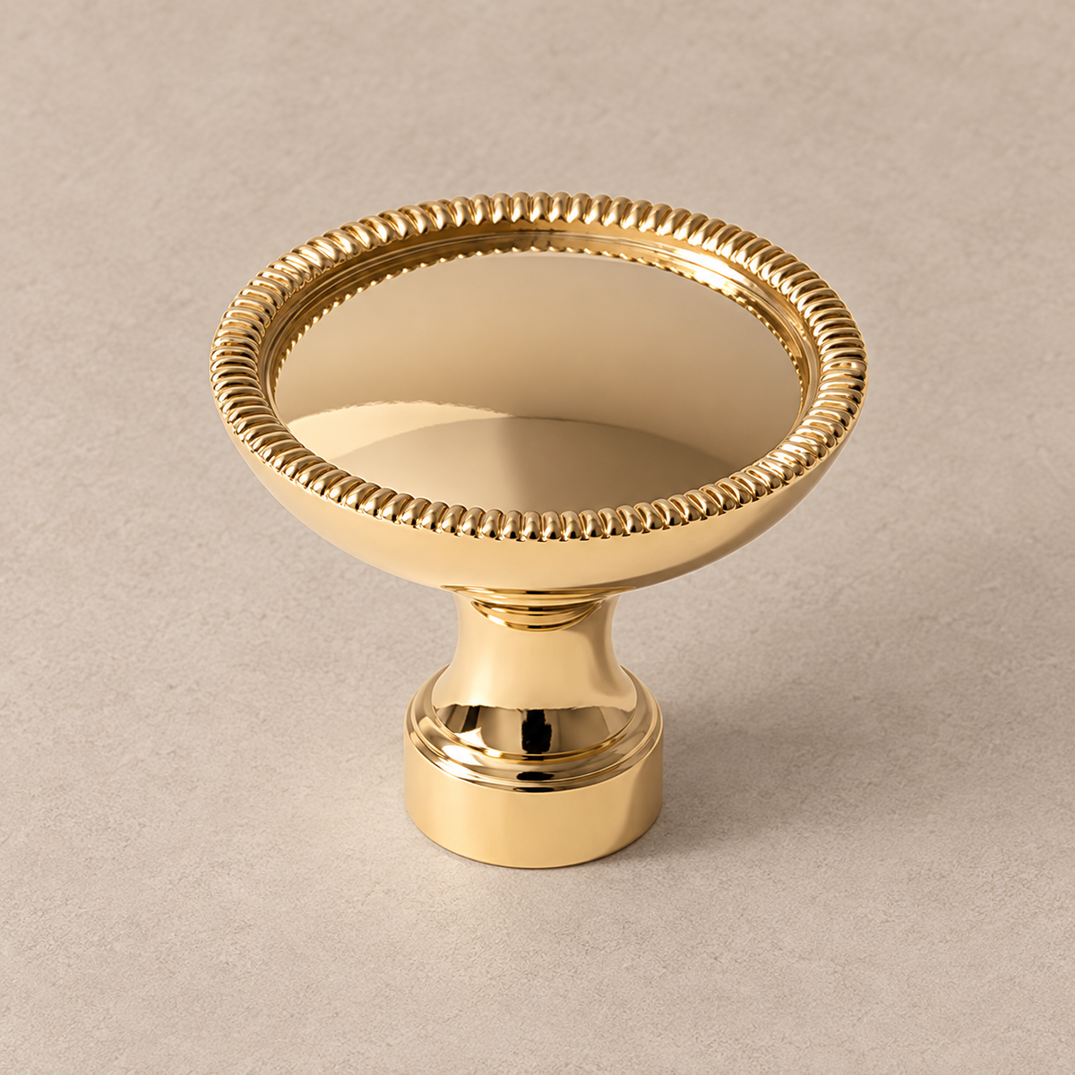 Polished gold cabinet knob with beaded rim