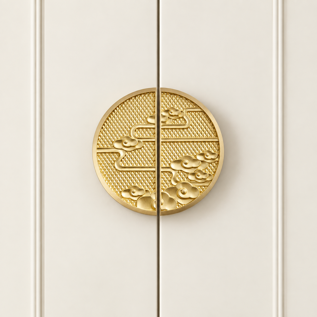 Gold cloud motif half-circle cabinet pulls installed on cream doors
