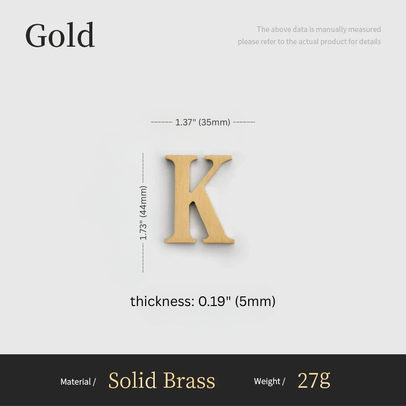 Gold letter 'K' with measurements on a white background