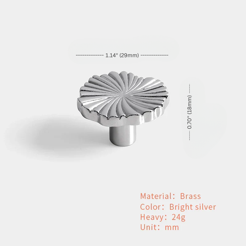 Metallic knob with measurements on a white background