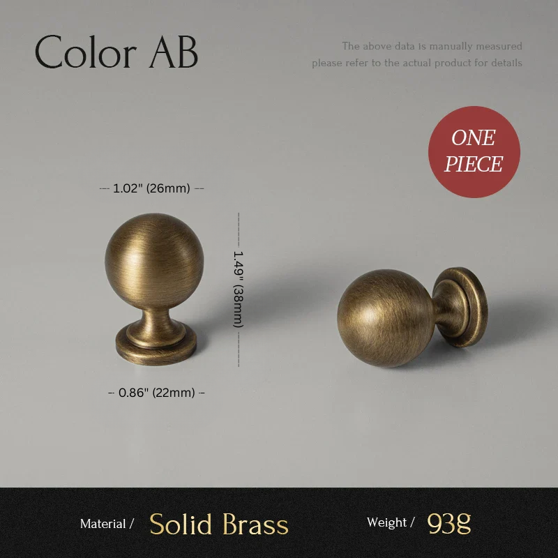 Two solid brass cabinet knobs with measurements on a gray background
