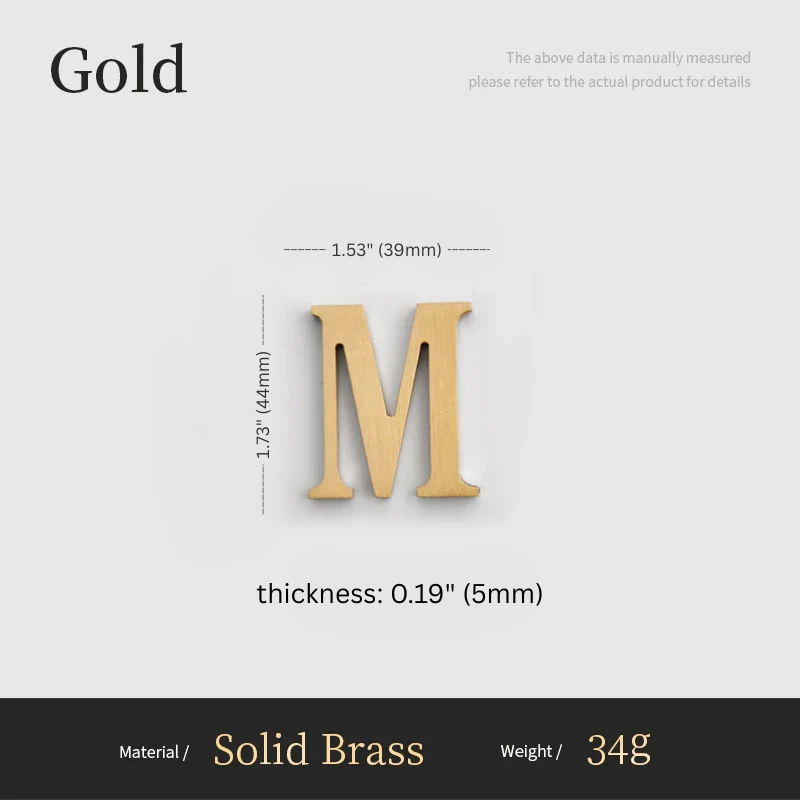 Gold letter 'M' with measurements on a gray background