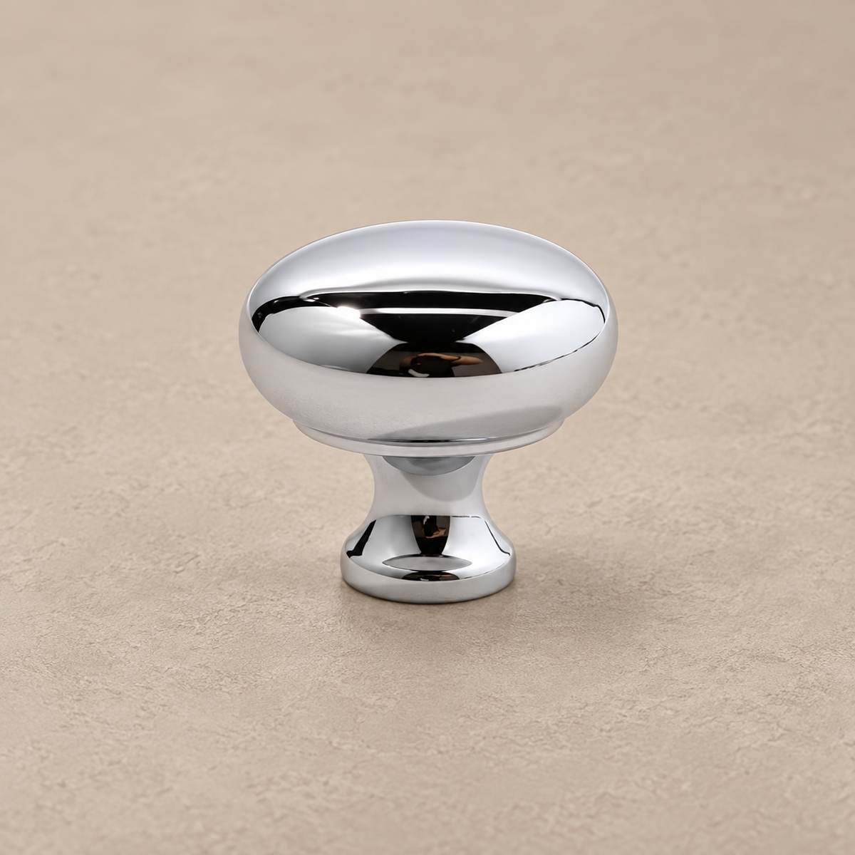 Chrome silver mushroom cabinet knob on taupe plaster