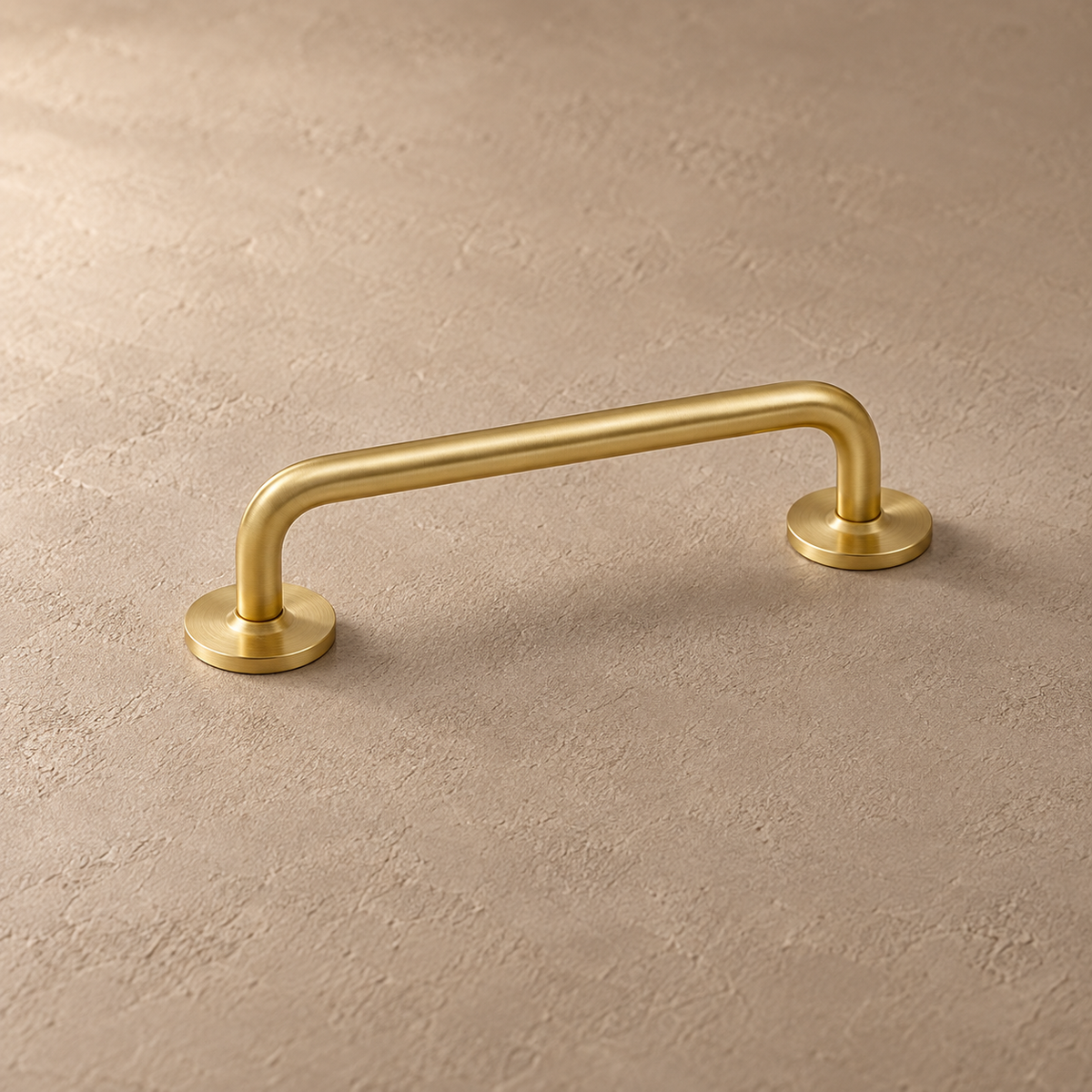 Slim brass Nordic pull with round mounting bases