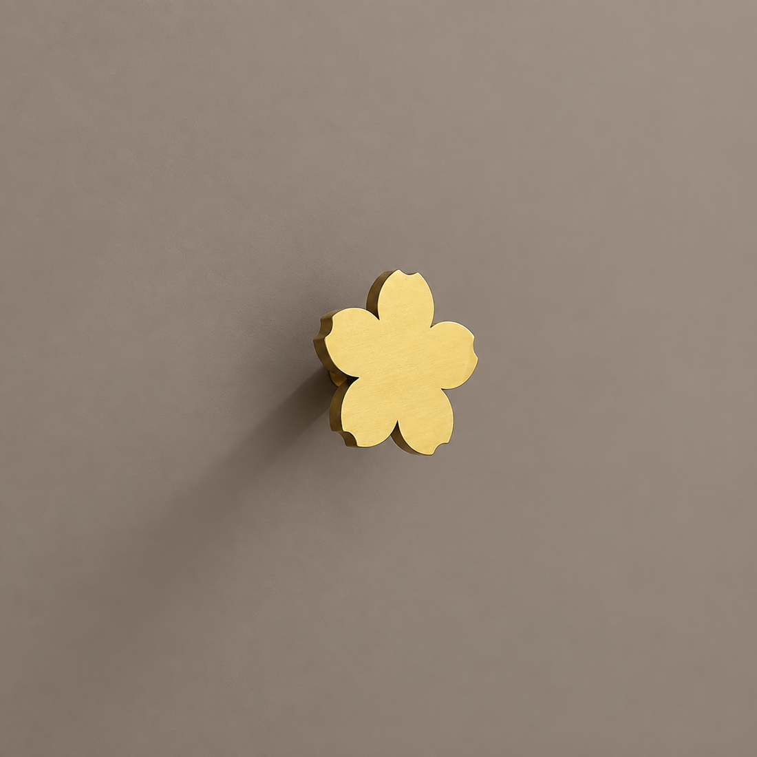 Polished Brass Solid Brass Cabinet Knob — Floral Design on a neutral stone studio background