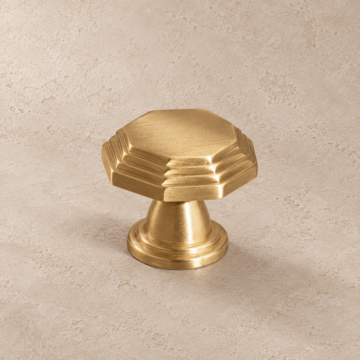 Polished brass octagonal cabinet knob detail